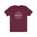 BEACHES AND PUCKS TEE